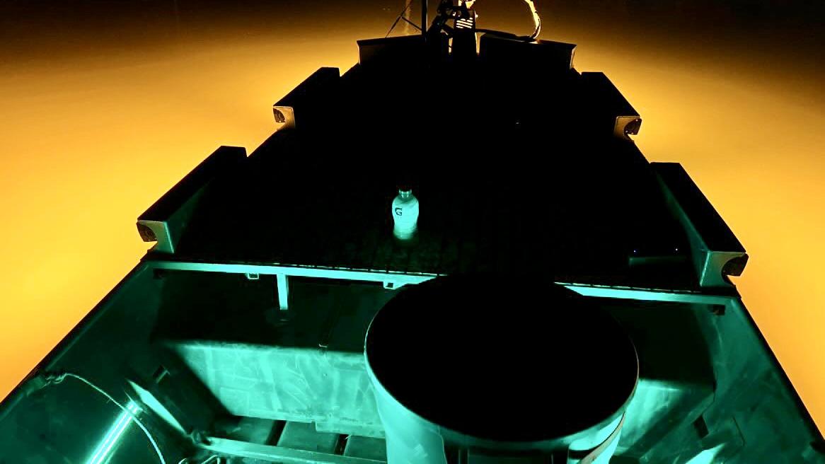 Bowfishing boat at night showing wide flood light coverage and controlled illumination on the water surface