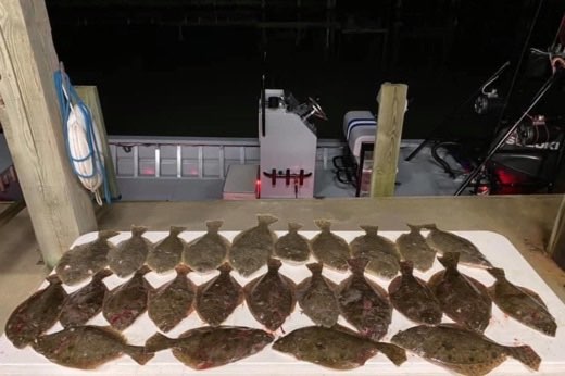 flounder gigging trip in aluminum boat
