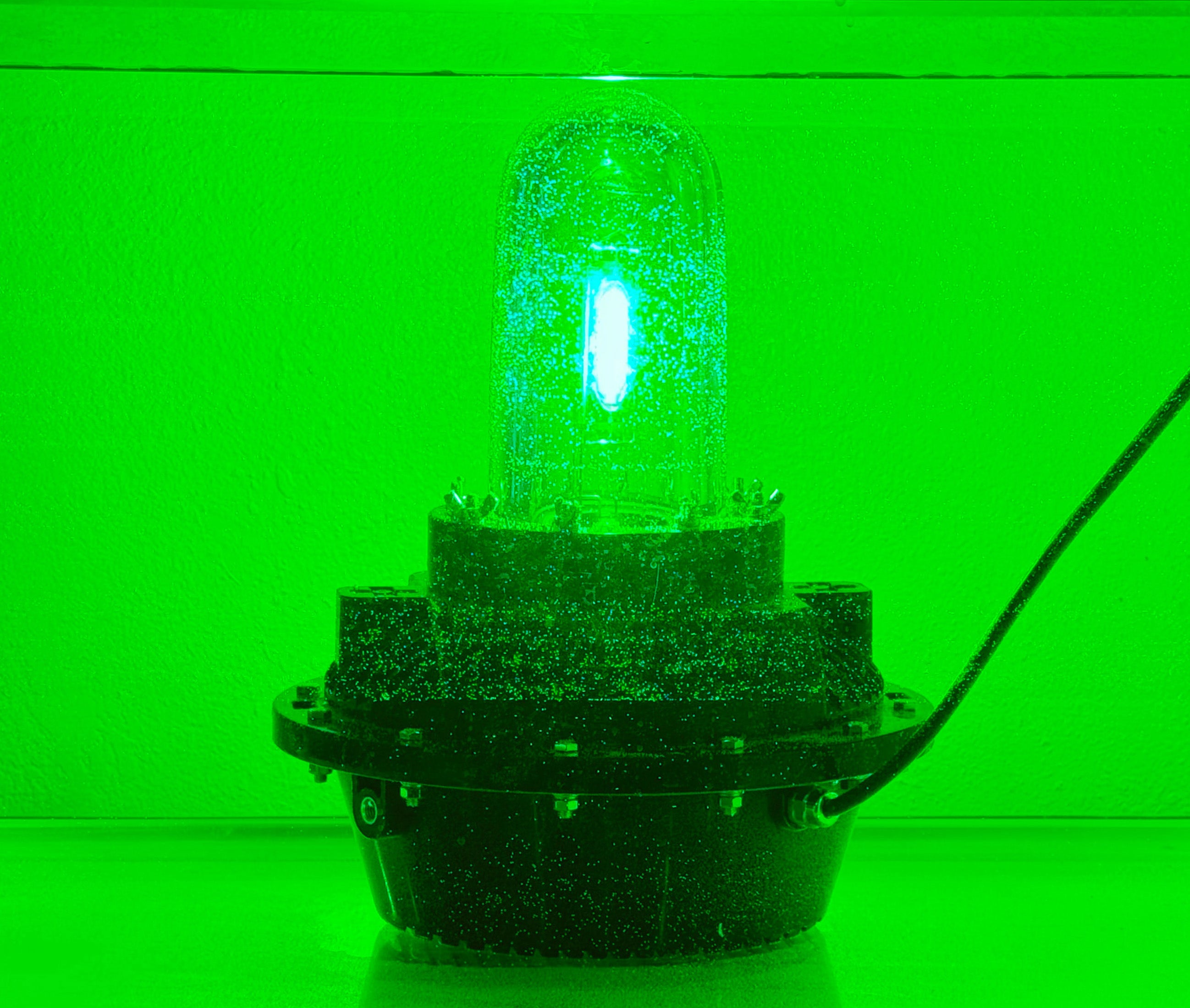 Green underwater fishing light for docks, piers, and boats – submersible illumination designed to attract baitfish and brighten waterfront areas.